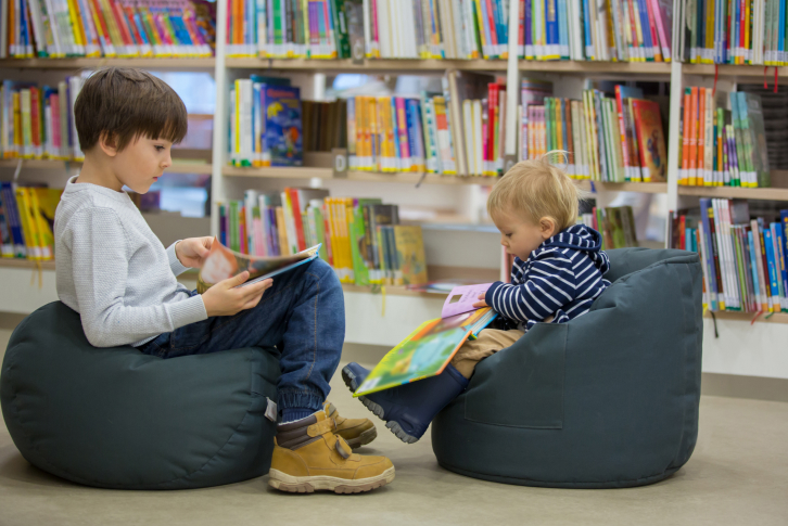 Children in library reading books