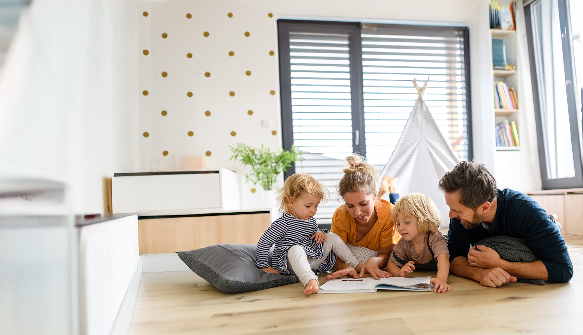 Family relaxing on floor at home